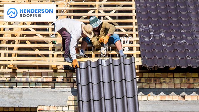 Roofer installing faux slate shingles on a residential roof.